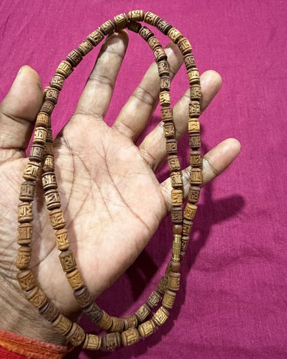 2 round brown radha name beads tulsi mala featuring Radha name beads in a traditional Tulsi design